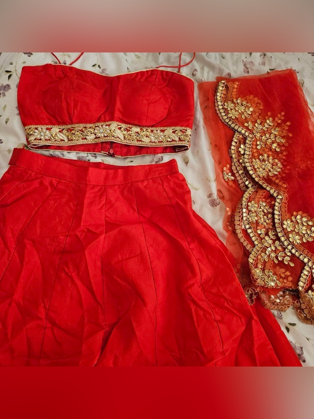 Red Lehenga Set with Intricate Gold Beaded Embroidery.